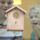 children amazed at birdhouse